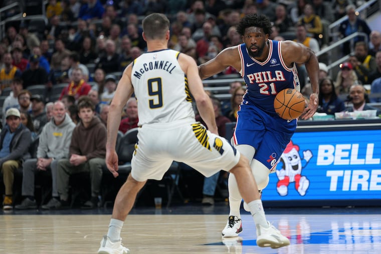 Sixers center Joel Embiid (right) scored 27 points after missing the last five games.