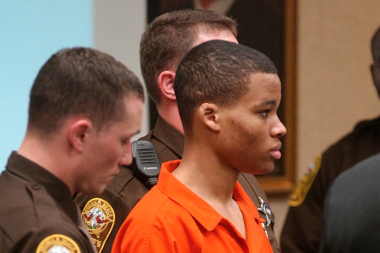 Lee Boyd Malvo listens to court proceedings during the trial of fellow sniper suspect John Allen Muhammad in Virginia Beach, Va., in 2003.