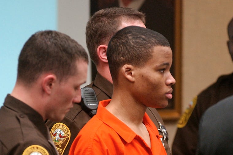 Lee Boyd Malvo listens to court proceedings during the trial of fellow sniper suspect John Allen Muhammad in 2003.