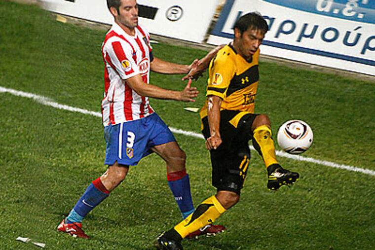 "My job is to score goals, but also be a mentor," Carlos Ruiz said. (Dimitri Messinis/AP file photo)