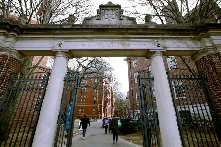 File photo of a gate that opens to the Harvard University campus in Cambridge, Mass.