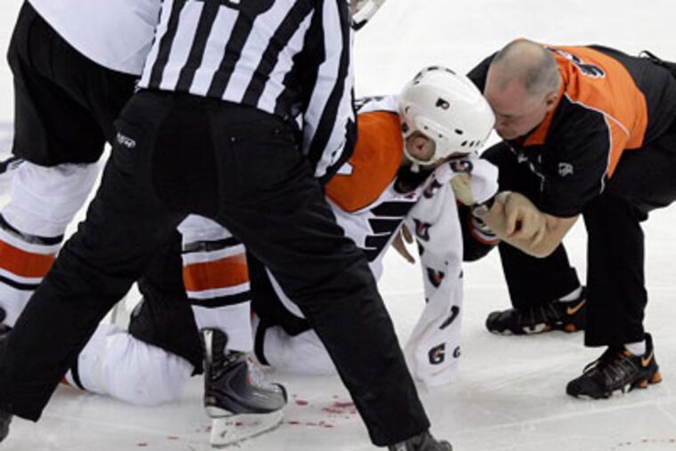 Ian Laperriere has repeatedly taken shots for the team. "It's about timing and desire to block it," he said. (Yong Kim / Staff Photographer)
