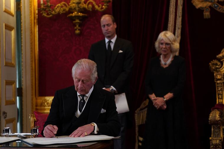 King Charles III signs an oath to uphold the security of the Church in Scotland during the Accession Council at St James's Palace, in London, on Saturday.