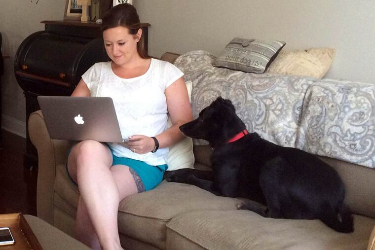 Colleen Grucella checks on her Airbnb listing from her South Philadelphia home. She was among many city residents who had their first Airbnb guests during the Democratic National Convention.