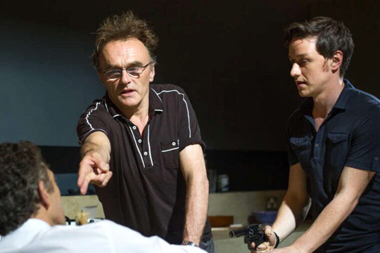 Director Danny Boyle (center) , James McAvoy (left), and Vincent Cassel on the set of "Trance," centered on an art theft. (SUSIE ALLNUTT)