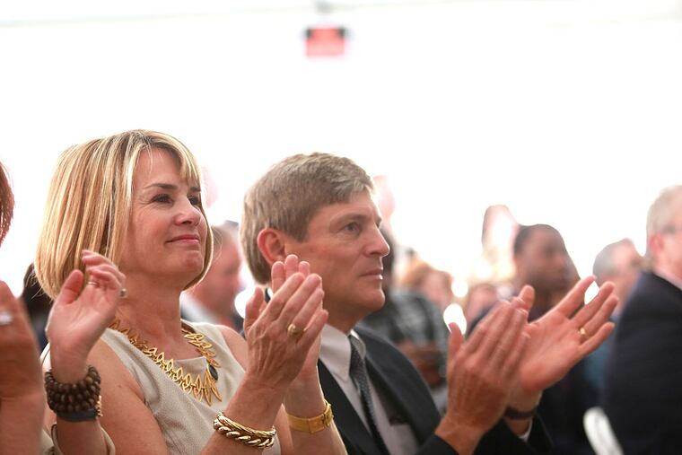Leigh and John Middleton listen to the speakers at the dedication of JBJ Soul Homes 15th and Fairmount Tuesday, April 22, 2014. ( DAVID SWANSON / Staff Photographer )