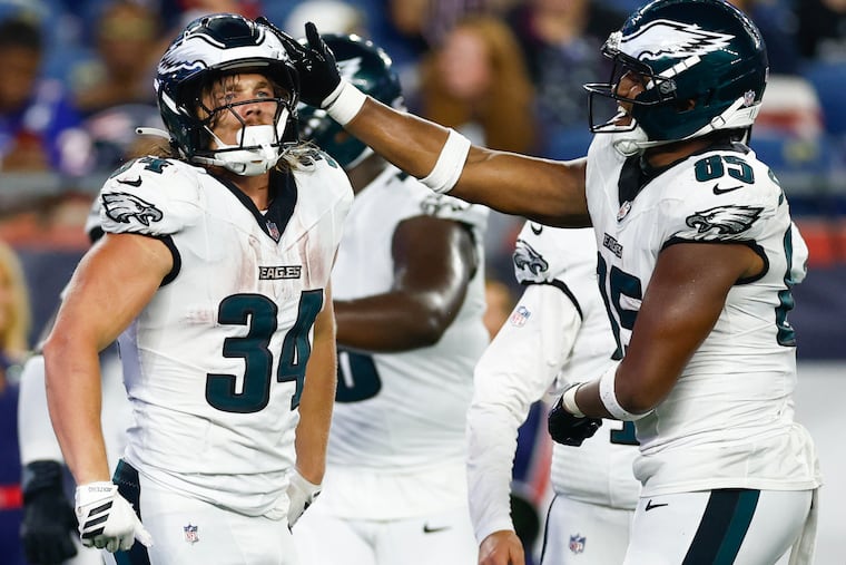Eagles running back Carson Steele celebrates his touchdown with tight end Stone Smartt during the fourth quarter.
