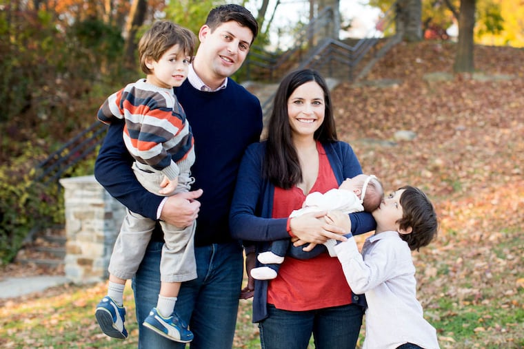 Dad Jason with Abram, mom Elyse with Margot, and big brother Holden.