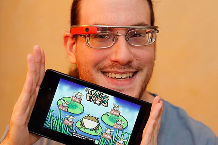 Dan Fishbach, 27 shows his creation, a game called "Frantic Frog" on his Nexus tablet on Tuesday, April 8, 2014. ( AKIRA SUWA / Staff Photographer )