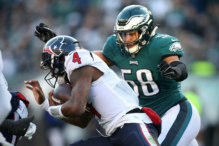 Eagles linebacker Jordan Hicks (58) prepares to tackle Houston Texans quarterback Deshaun Watson (4) during a game at Lincoln Financial Field in South Philadelphia on Sunday, Dec. 23, 2018. The Eagles won 32-30. TIM TAI / Staff Photographer