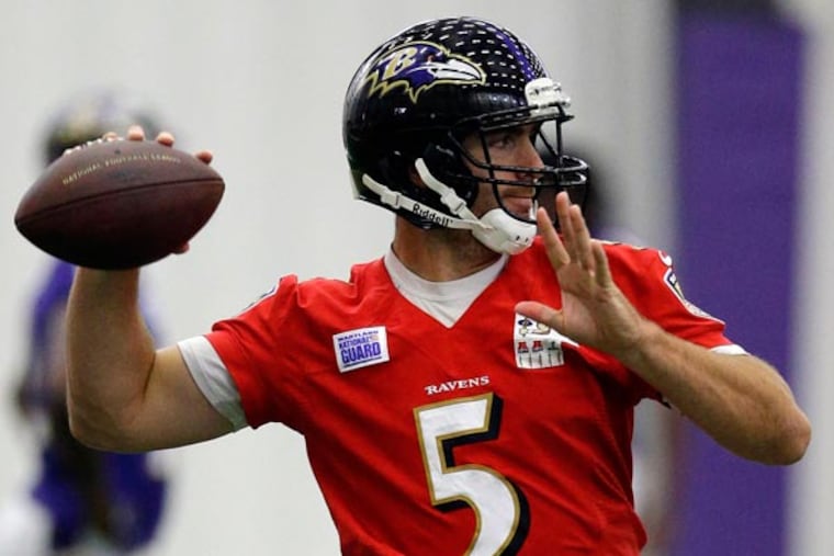 Ravens quarterback Joe Flacco throws a pass during an NFL football practice at the team's practice facility in Owings Mills, Md., Thursday, June 13, 2013. (Patrick Semansky/AP)