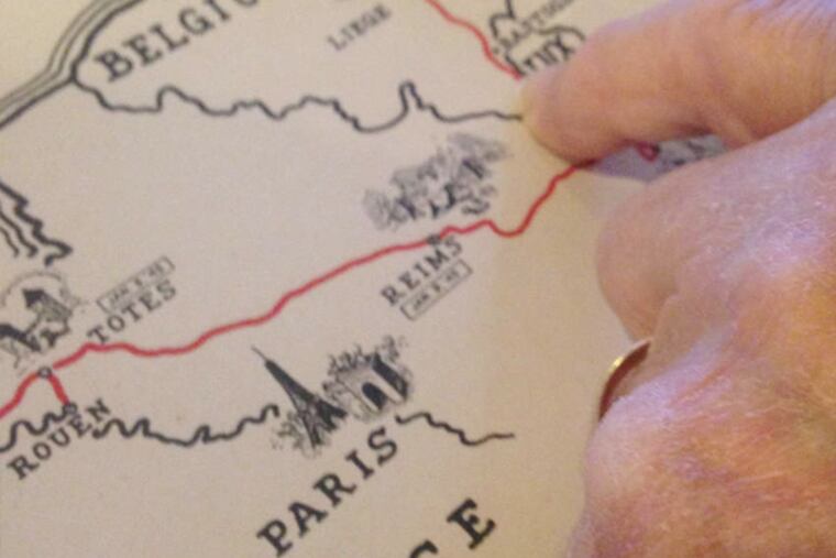 Romeo Battilana, 91, uses a map to describe his movements after the Battle of the Bulge with Company B, 49th Armored Infantry Battalion, Eighth Armored Division.