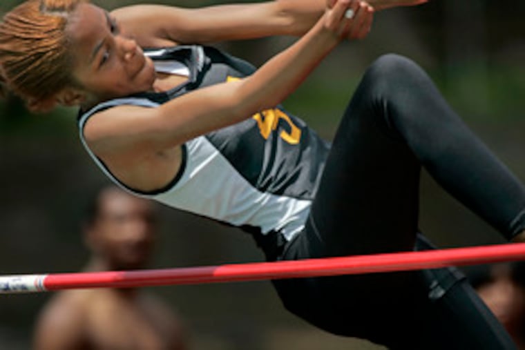 Engineering and Science's Morgan Heath competes in the Class AA high jump. She won the event with a jump of 4 feet, 8 inches.
