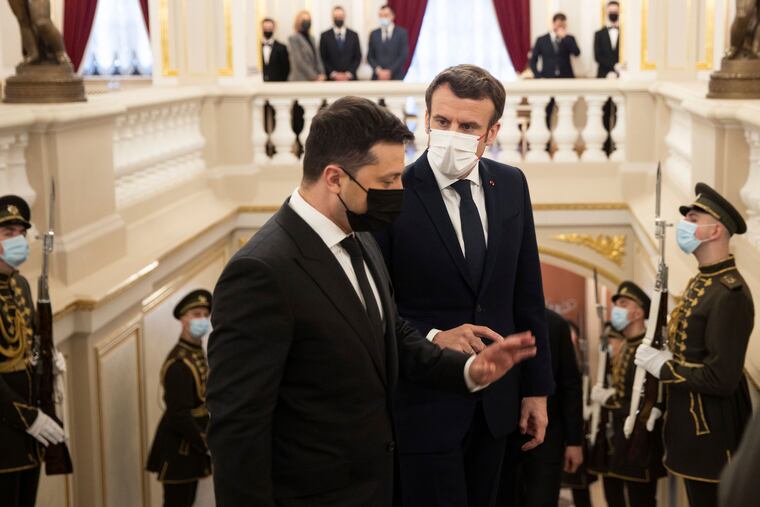 In this handout photo provided by the Ukrainian Presidential Press Office, Ukrainian President Volodymyr Zelenskyy (left) and French President Emmanuel Macron talk during their meeting in Kyiv, Ukraine on Tuesday.