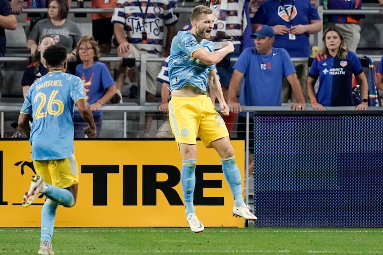 Kacper Przybylko (right) celebrates after scoring his goal.