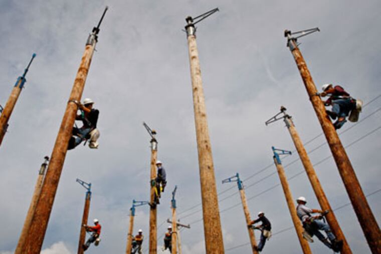 Apprentice candidates practice climbing during a round-robin exercise. They went up and down 12 times during the day.( Michael S.Wirtz / Staff Photographer )