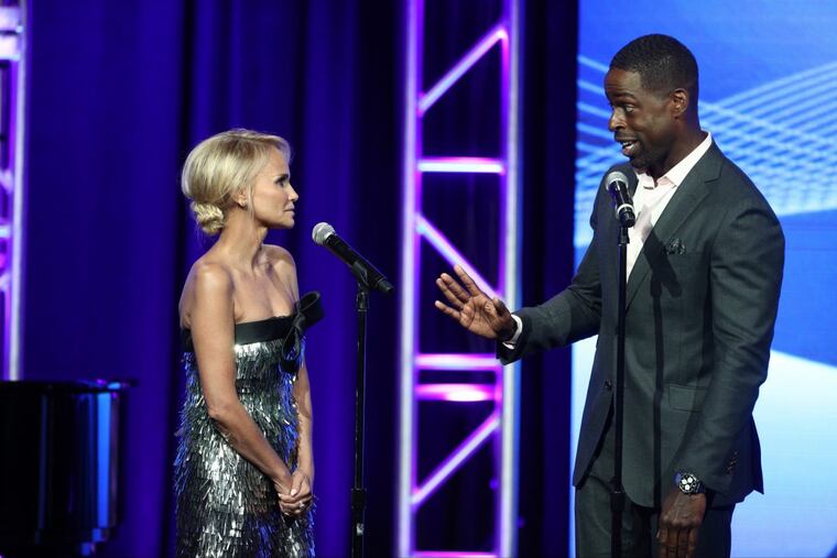 Host Kristin Chenoweth (left) and "This Is Us" star Sterling K. Brown perform a duet during the Television Critics Association Awards on Aug. 5, 2017, at the Beverly Hilton
