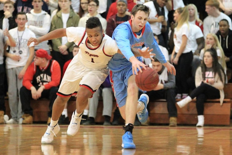 Amin Bryant, left, of Archbishop Ryan and Tom Quarry of Father Judge go after a loose ball after Bryant had deflected it away in the 2nd quarter on Jan. 19, 2018.