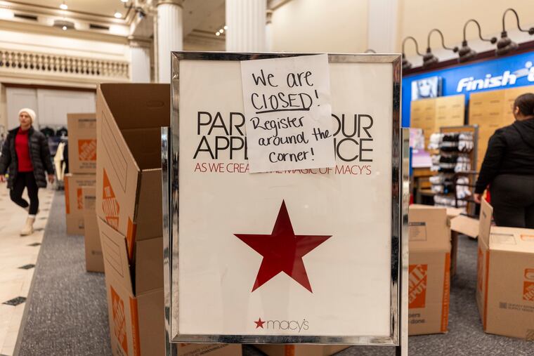 Workers pack up inventory in preparation for the closing of the Macy's store in Center City Philadelphia on Friday, Jan. 10, 2025. Macy's is one of several retailers who have announced store closings so far this year.