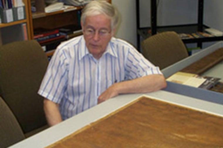 Tom Lingenfelder with his document while it was being restored at a conservation center in Philadelphia. (Photo by G. McCurdy)
