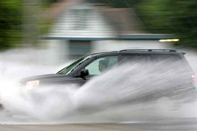 Motorists navigate Route 1 in Chadds Ford in the midst of 2008's Hurricane Hanna. The 2010 hurricane season could be an "extreme season," forecasters say. (DAVID SWANSON/Inquirer)