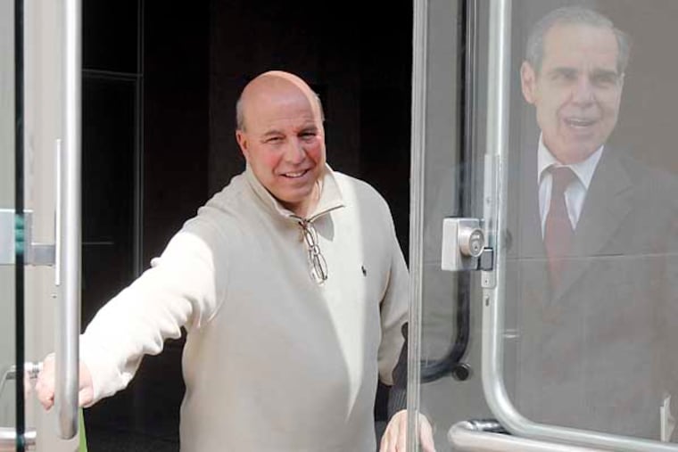 Dominic Verdi, left, the former deputy commissioner of the city Licenses & Inspections Department, who allegedly extorted nearly $1 million in beer sales, leaves the Federal Courthouse with his lawyer, Frank DeSimone, after Wednesday's arraignment. ( AKIRA SUWA / Staff Photographer )