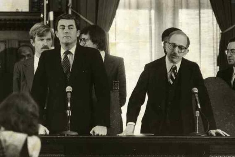 Mayor William Green (left) had a sour relationship with Council , and as a result Council blocked some of his legislative efforts. He and City Solicitor Alan Davis (right) announce a reorganization in 1980.