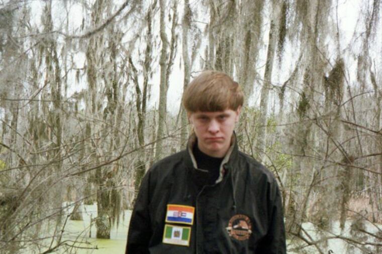 Dylann Roof is pictured in this undated photo taken from his Facebook account. Roof is suspected of fatally shooting nine people at a historically black South Carolina church in Charleston on June 17, 2015. He can be seen in his Facebook profile picture in a jacket that bears the flags of apartheid-era South Africa (top) and the former Rhodesia, now Zimbabwe. (Facebook account of Dylann Roof)