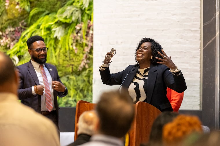 Mayor Cherelle L. Parker speaking Friday at a new conference on the future of East Market Street. Jessie Lawrence, Philadelphia director of planning and development is pictured left.