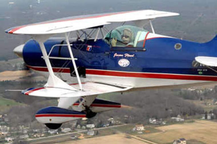 Jason Flood soars above Hammonton, N.J. "It's totally a different world when you leave the ground," he says. (April Saul / Staff Photographer)