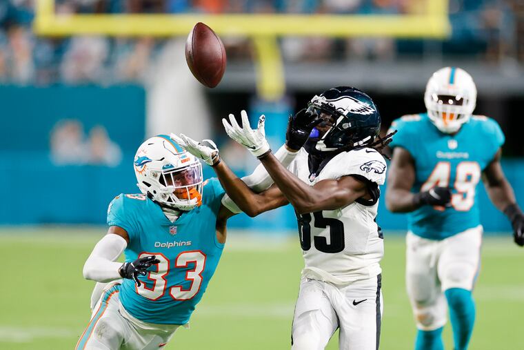 Eagles wide receiver Deon Cain loses the football after committing an offensive pass interference penalty against Miami Dolphins cornerback Elijah Hamilton in the third quarter during a preseason game at Hard Rock Stadium on Saturday, August 27, 2022 in Miami Gardens, Florida.