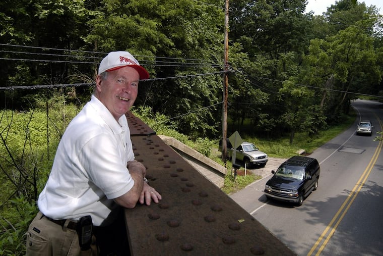 Radnor Township Commissioner Bill Spingler walks along the old Philadelphia and Western Line railroad overpass at Conestoga and Brookside in Wayne.