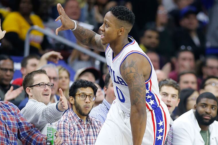 Isaiah Canaan runs along the sidelines after hitting a 3-pointer.