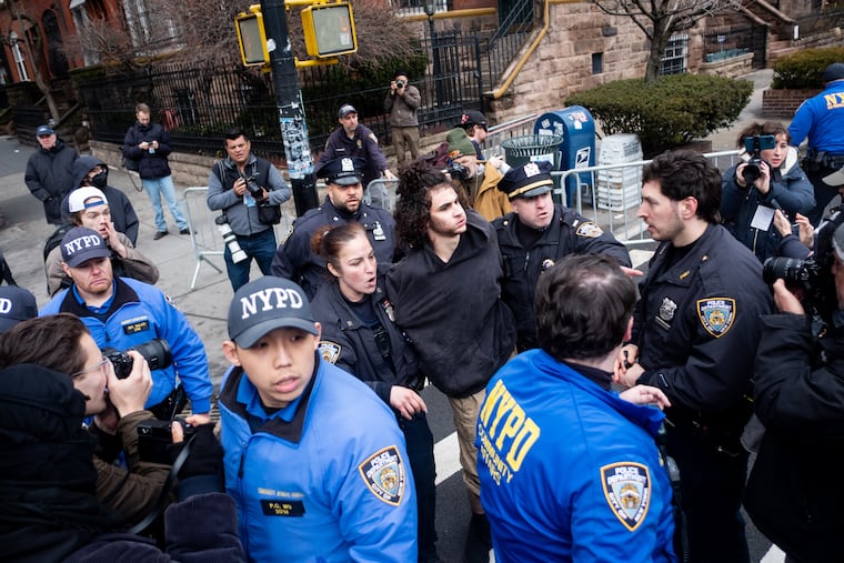 Police detain Emir Balat after he attempted to detonate an improvised explosive device during a counterprotest against an anti-Islam gathering outside Gracie Mansion on March 7.