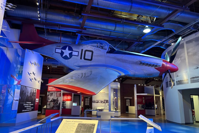 A full-size replica of a P-51 Mustang flown by the Tuskegee Airmen during World War II is displayed in a museum in Tuskegee, Ala.
