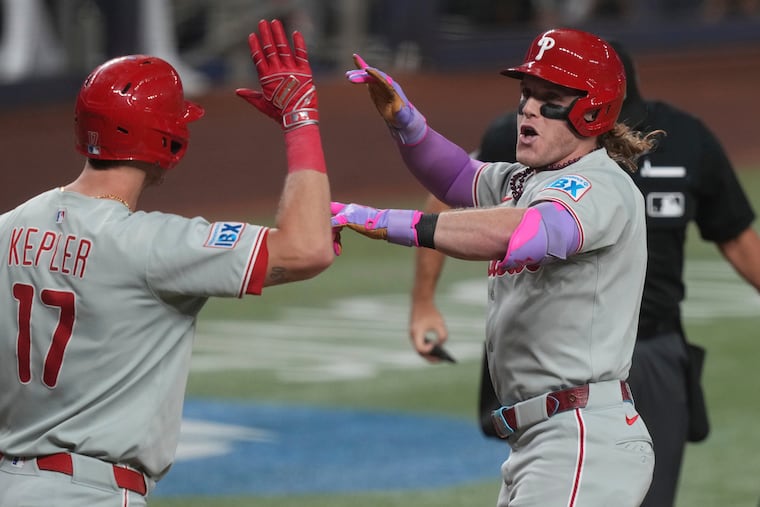 Harrison Bader (right) celebrates with Max Kepler after hitting a home run during the fourth inning against the Marlins.