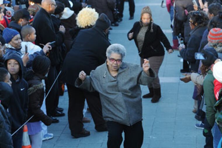 Vernyce Dannells (foreground) dances down the Soul Train Line. Philadelphia attempts to break the Soul Train Line Guiness World Record at the Philadelphia Museum of Art this afternoon in honor of the late Don Cornelius. February 13, 2012 ( SARAH J. GLOVER / STAFF PHOTOGRAPHER ) EDITOR'S NOTE; SOUL-K Philly attempts to break the Guiness World Record for the Soul Train Line. Nutter didn't actually dance; he walked and gave high-fives.