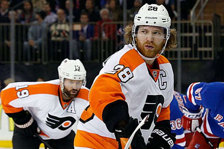Flyers forward Scott Hartnell and captain Claude Giroux. (Yong Kim/Staff Photographer)
