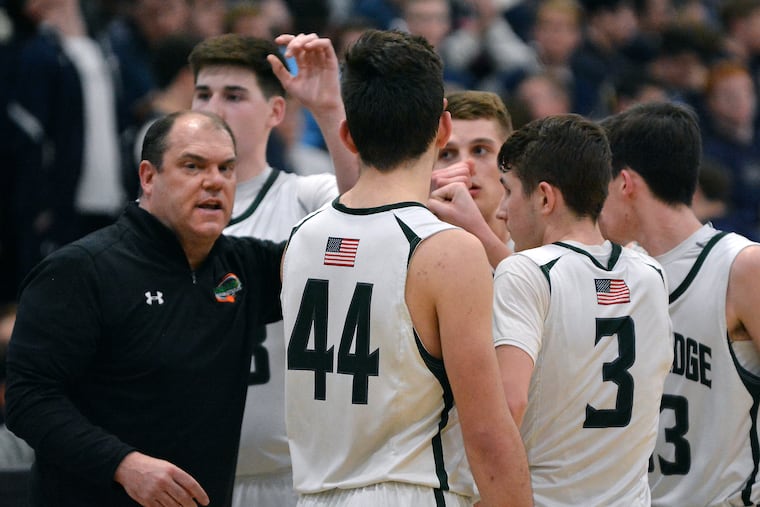 Pennridge coach Dean Behrens rallies his team in the closing seconds of the Rams' 52-47 victory over La Salle in the PIAA Class 6A state semifinals.