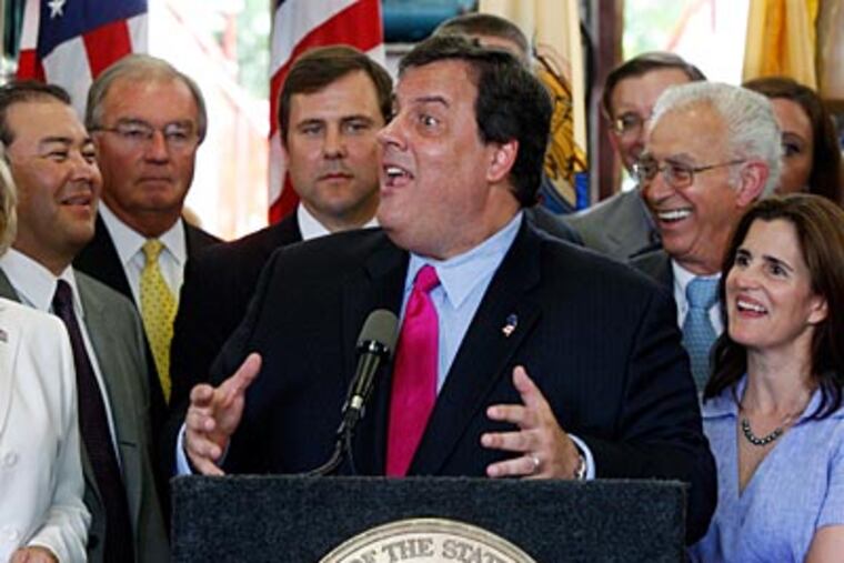New Jersey Gov. Chris Christie reacts to a question after signing the state's budget into law on Tuesday. (AP Photo/Mel Evans)