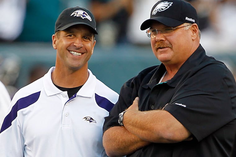 Baltimore Ravens head coach John Harbaugh, left, talks with former Eagles head coach Andy Reid. Harbaugh was an assistant with the Philadelphia Eagles from 1998-2007. (AP Photo/Alex Brandon)