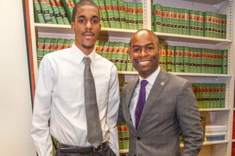 Rashon Bennett, 18, and his mentor Lloyd Freeman, 30, in the Archer & Greiner Library in Haddonfield, NJ August 22, 2012. Rashon is about to start his freshman year at Seaton Hall University and his mentor Lloyd Freeman couldn't be more proud. (ELISE WRABETZ / Staff Photographer)