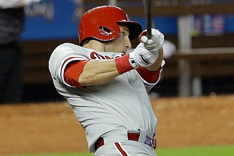 When Laynce Nix swung to secure the 200th victory of Roy Halladay's storied career, the pitcher did not immediately see it. (Alan Diaz/AP)