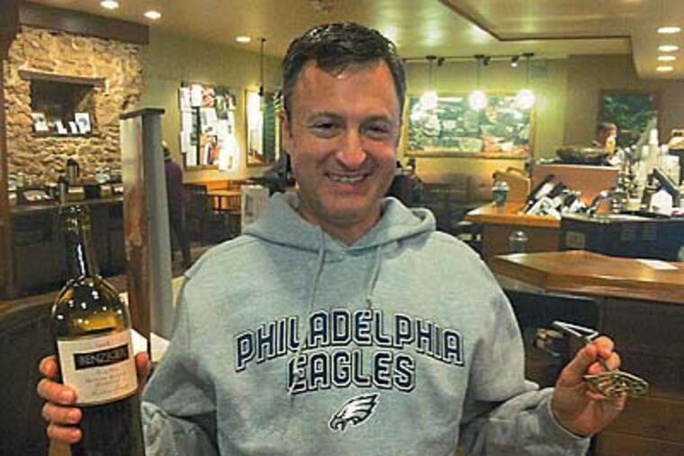 Howard Brooks, one of the road-trip organizers, with mementos. Community service is key. BILL REED / Staff