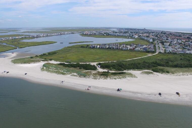 Vehicles on the beach in Brigantine. Driving on sand can be tricky, experts warn. (Drone images by PhotoGraphics)
