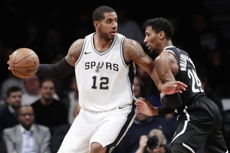 San Antonio’s LaMarcus Aldridge driving against Nets forward (and Chester High grad) Rondae Hollis-Jefferson last week.