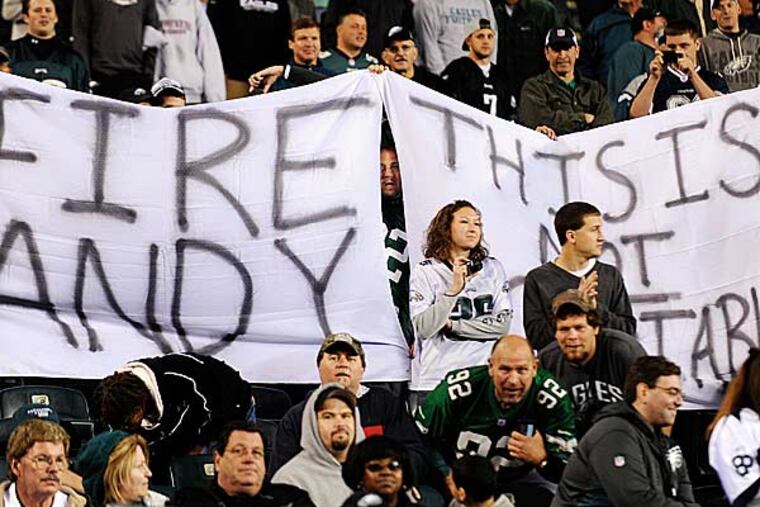 Philadelphia Eagles fans hold up a sign in the second half of an NFL football game against the Dallas Cowboys, Sunday, Nov. 11, 2012, in Philadelphia. Dallas won 38-23. (Michael Perez/AP)