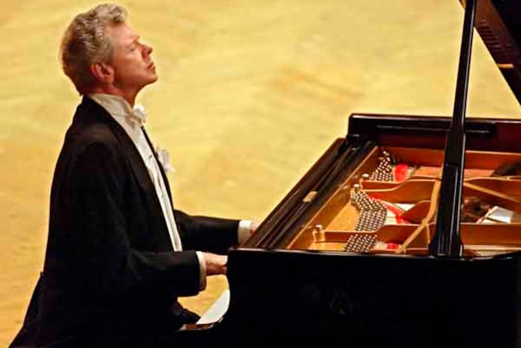 FILE - This Sept. 21, 2004 file photo shows pianist Van Cliburn performing during at a concert dedicated to the memory of the victims of the recent Beslan school massacre in Moscow. Cliburn, the internationally celebrated pianist whose triumph at a 1958 Moscow competition helped thaw the Cold War and launched a spectacular career that made him the rare classical musician to enjoy rock star status died early Wednesday, Feb. 27, 2013, at his Fort Worth home following a battle with bone cancer. He was 78. (AP Photo/Sergey Ponomarev, file)