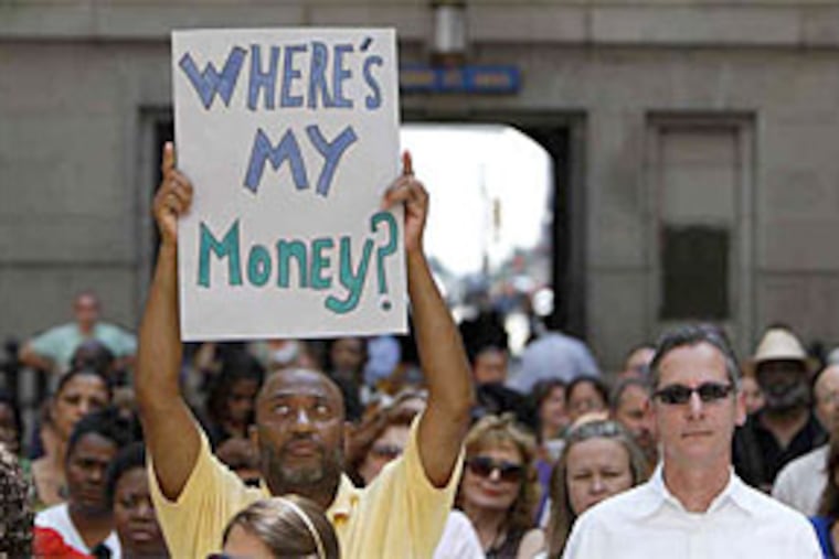 At the City Hall rally, Antonio Adolphues of BEBASHI, an AIDS service organization, demonstrates his frustration over not being paid. (David Maialetti / Staff Photographer)