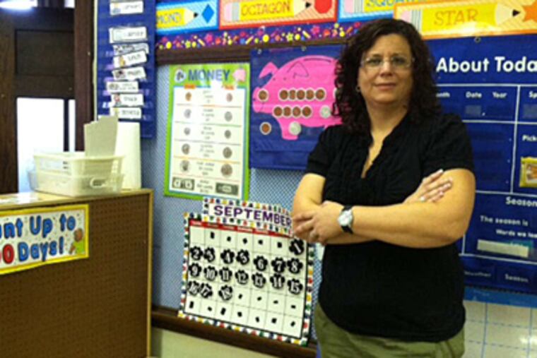 Richmond Elementary kindergarten teacher Jennifer Fagan wants to replace equipment in her room's "listening center." Much of her center's equipment was damaged by a flood in her room. (Regina Medina/Staff)